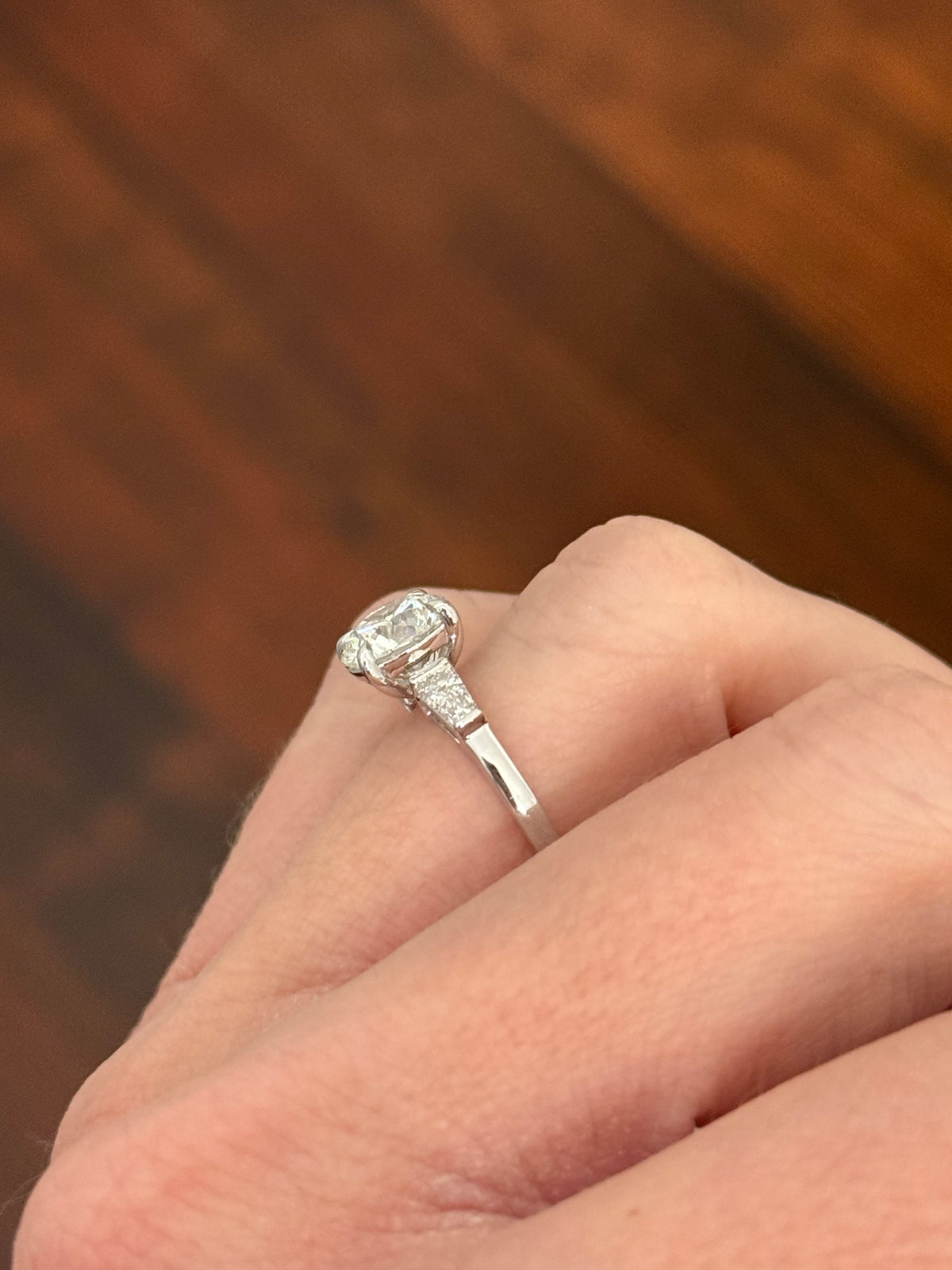 White gold IGI certified 2.04ct round lab diamond and tapered baguette lab diamond ring. Round measures 8.08x5.04mm