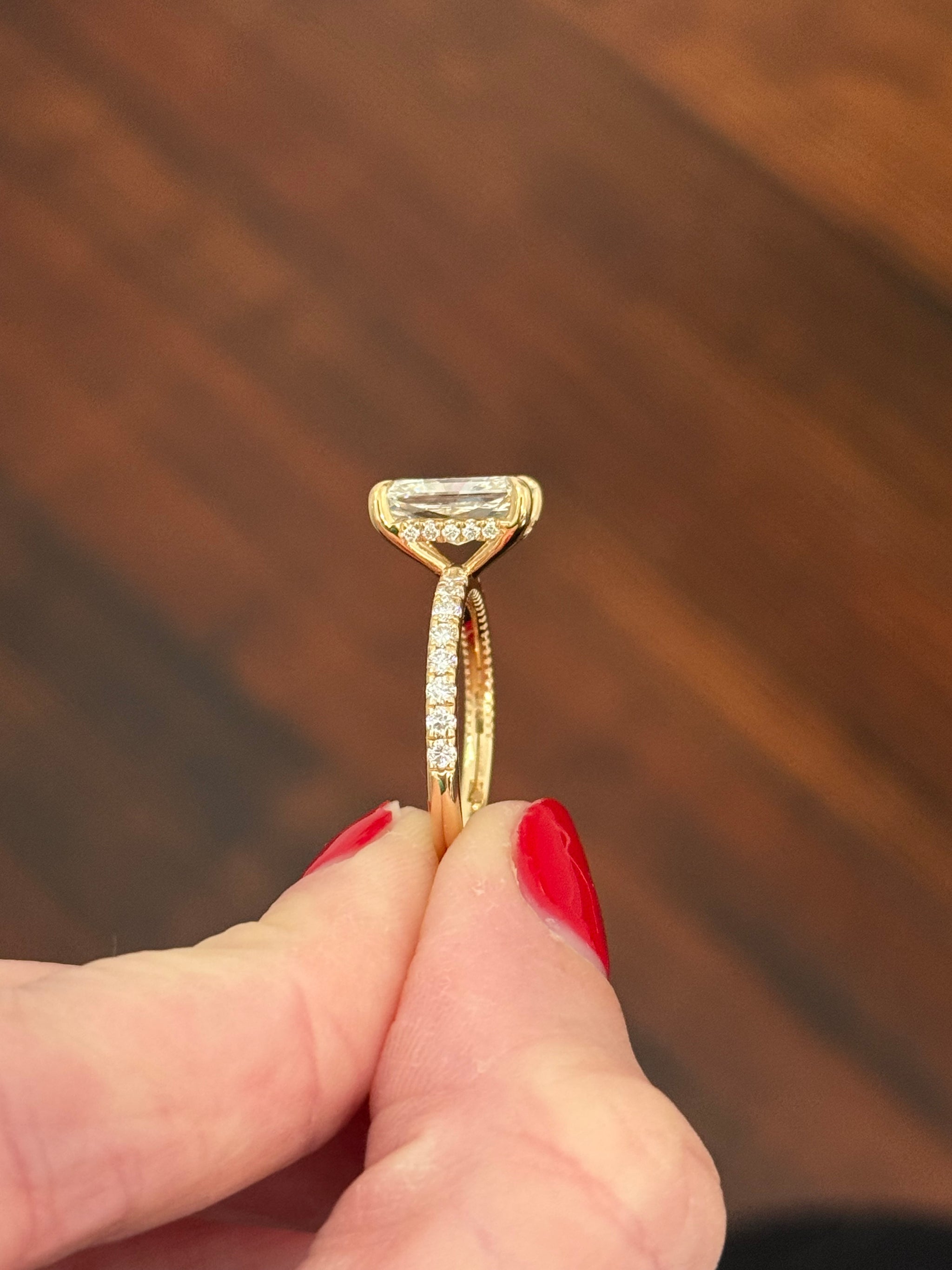 Yellow gold radiant lab diamond ring. Center stone is IGI certified and 3.0cts E VS1