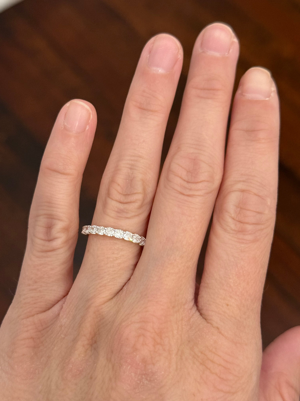 Yellow gold cushion cut lab diamond band. Prongs are white gold.