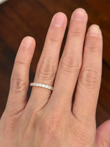Yellow gold cushion cut lab diamond band. Prongs are white gold.
