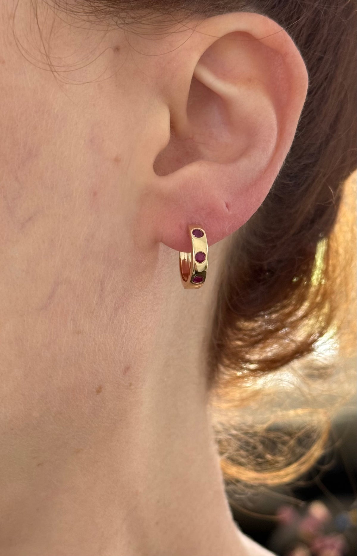 14.3mm hoop earrings available in yellow gold with rubies and white gold with emeralds