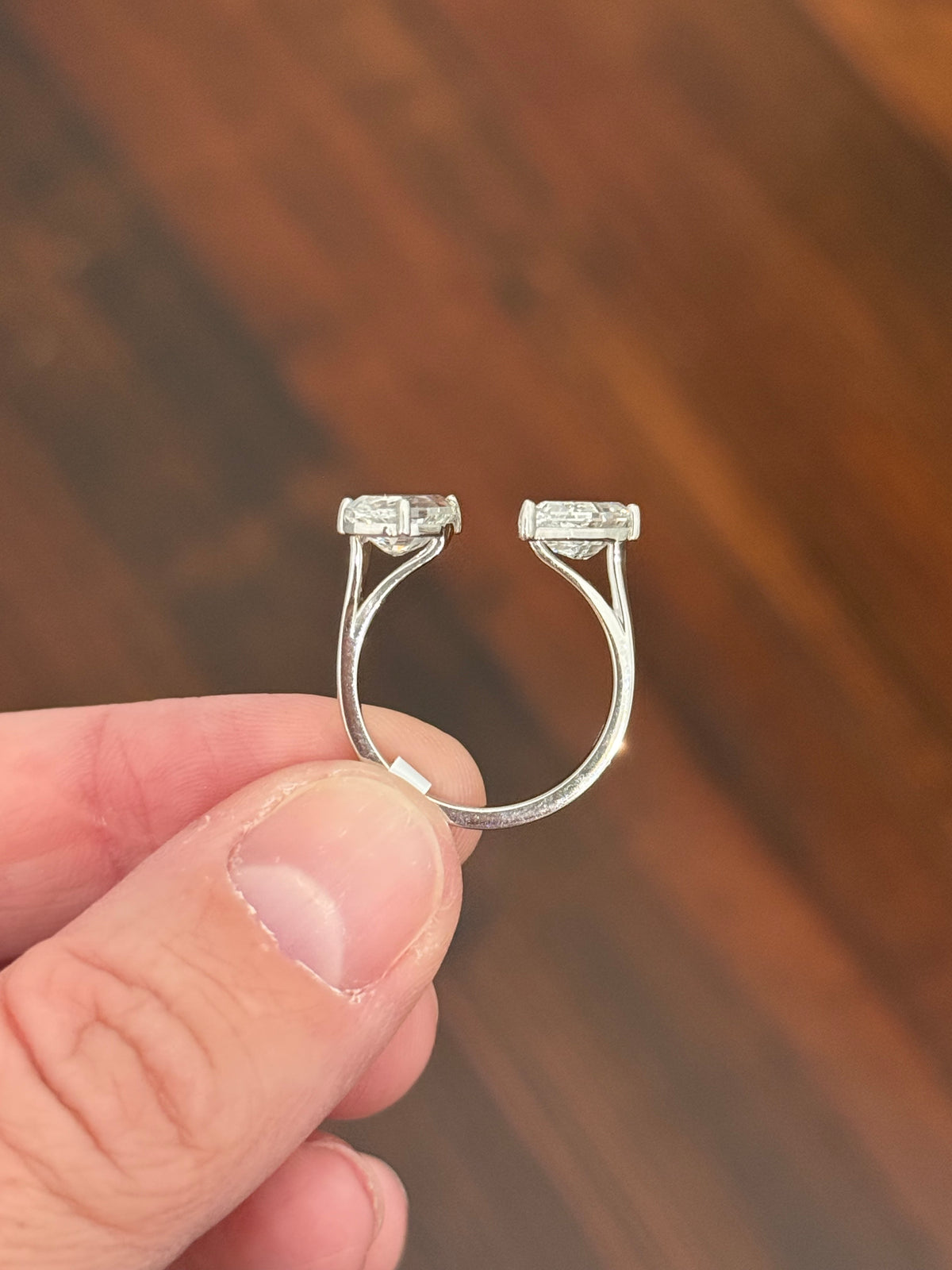 White gold 3.15ct step cut pear shape lab diamond bypass ring. Each measures 10.45x5.70mm