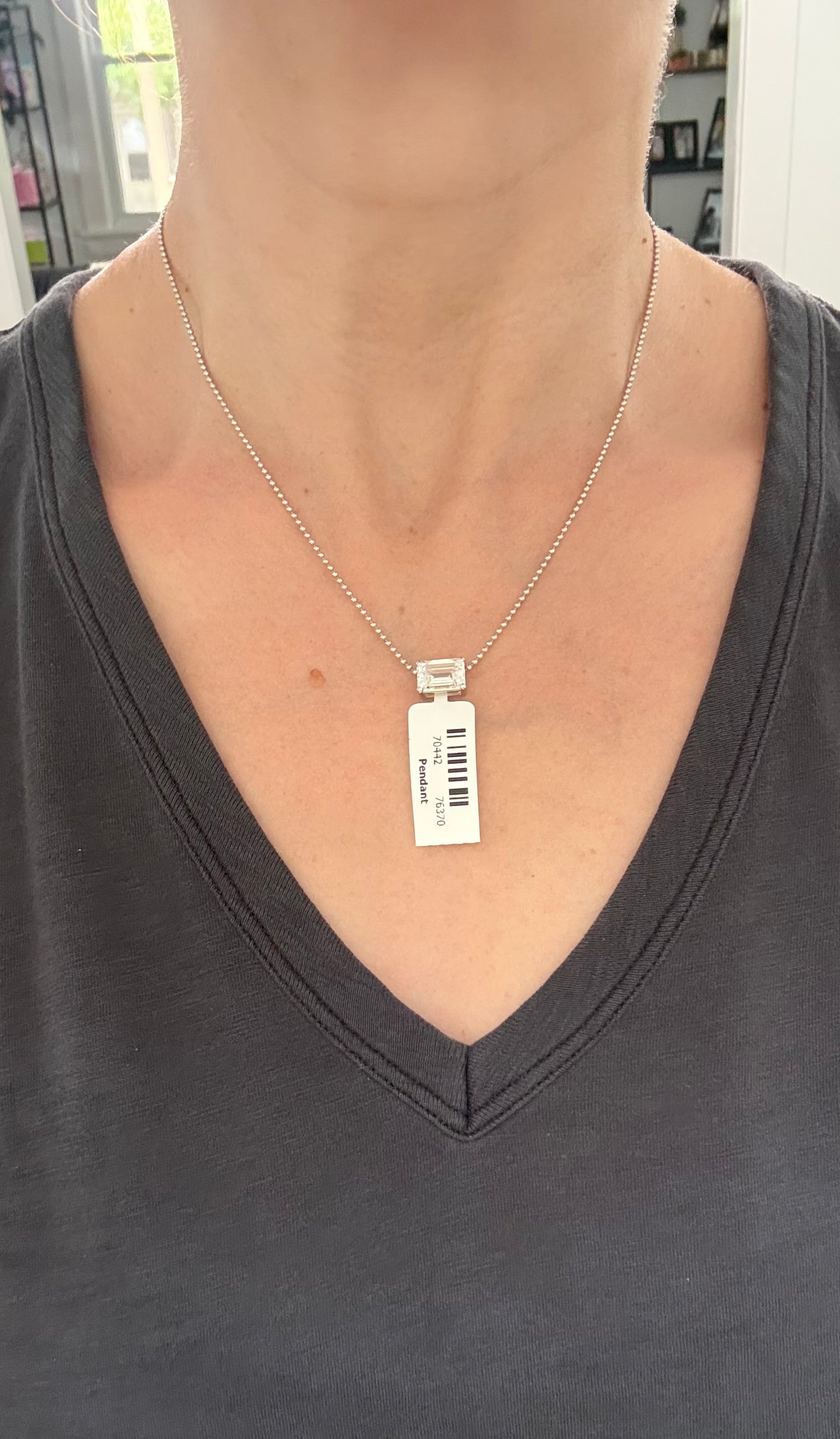 White gold IGI certified 4.1ct emerald cut lab diamond pendant. Can be worn east west and north south.