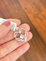 White gold heart pendant with round lab diamonds. Center stone is 7.0mm