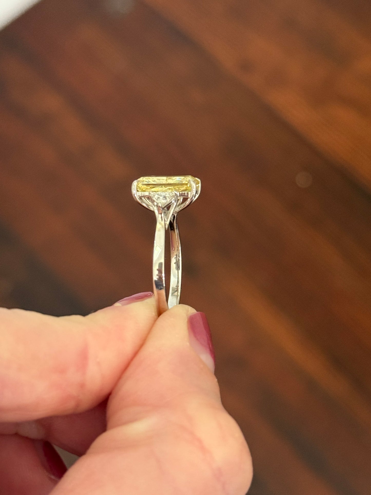 White gold radiant yellow lab diamond and trillion cut white lab diamond ring