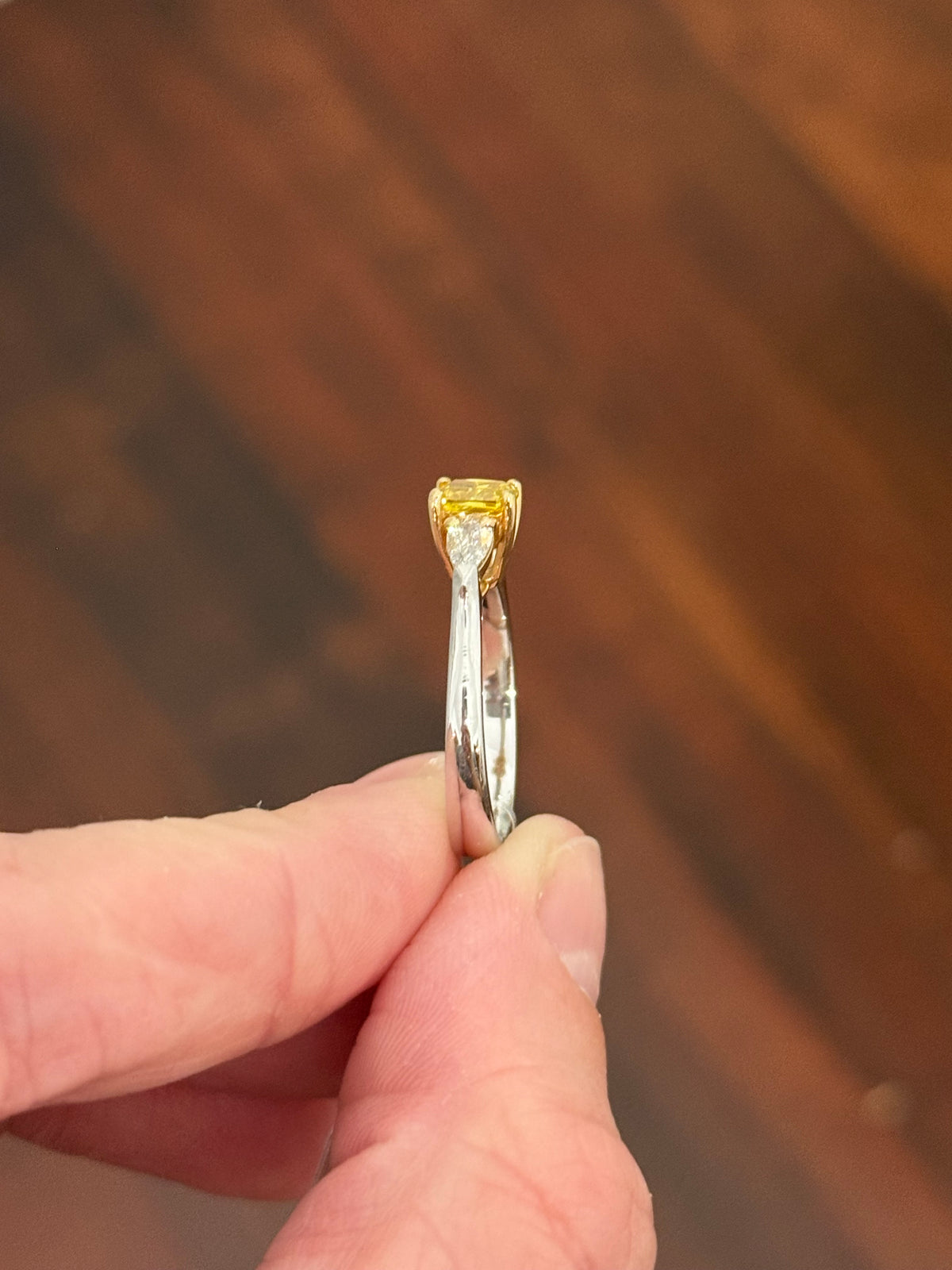 White gold cushion cut yellow lab diamond and pear shape white lab diamond ring. Lab diamonds set in yellow gold.