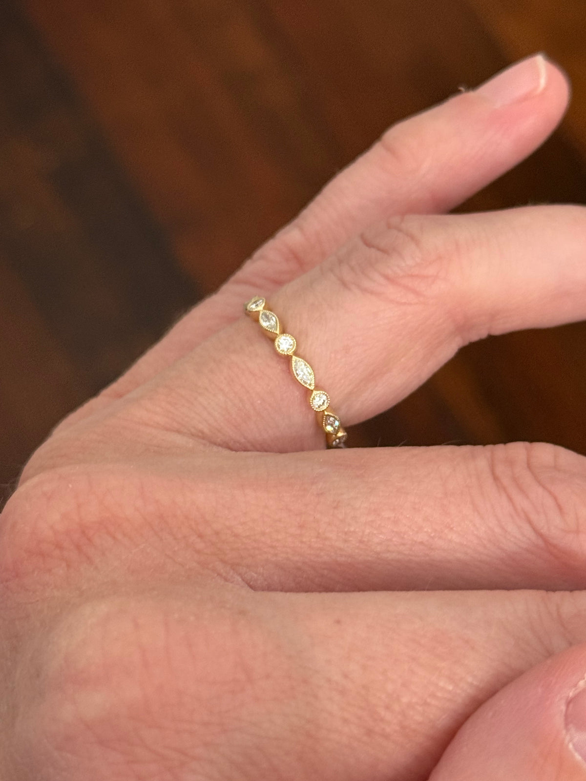 Yellow gold bezel set marquise and round lab diamond band