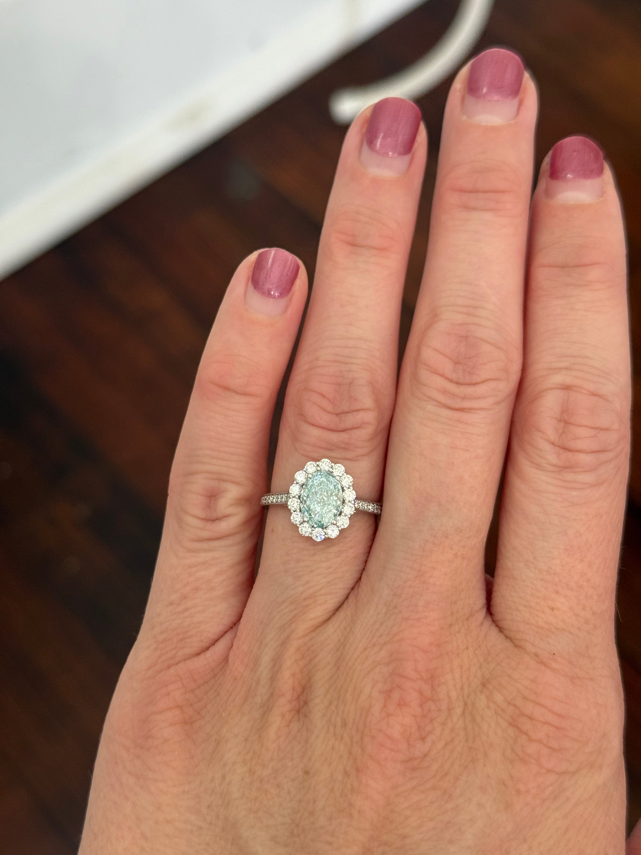 White gold oval blue lab diamond and white lab diamond ring