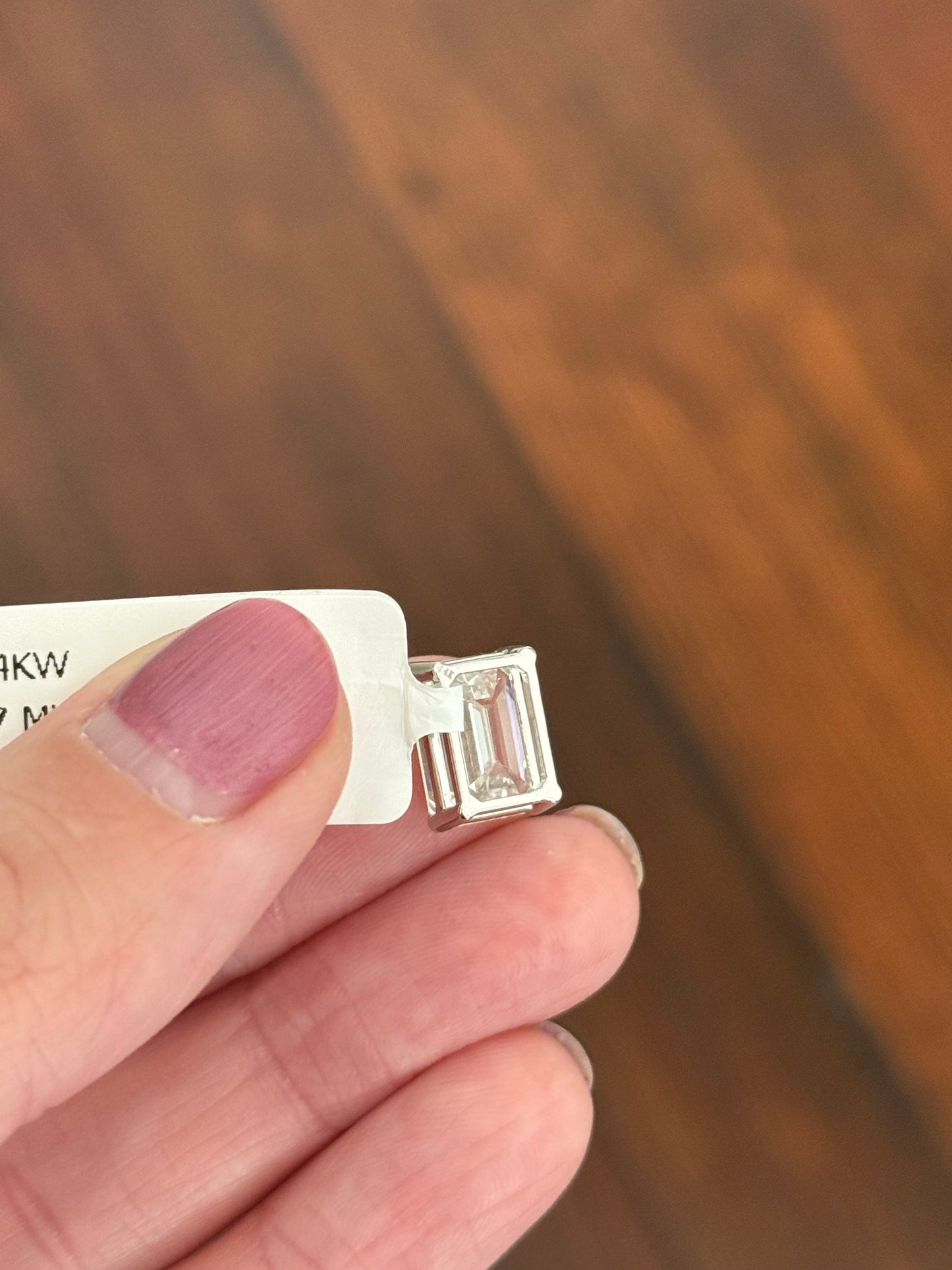 White gold IGI certified 4.1ct emerald cut lab diamond pendant. Can be worn east west and north south.