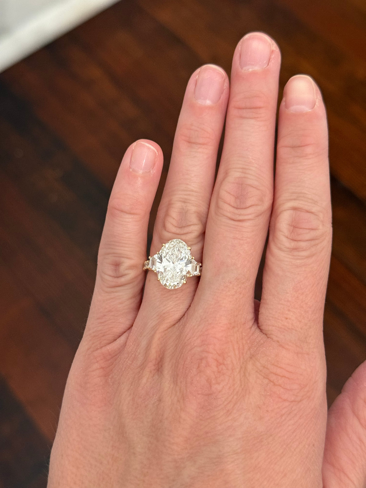 IGI certified oval and trapezoid and round lab diamond ring. Center stone is 6.52cts