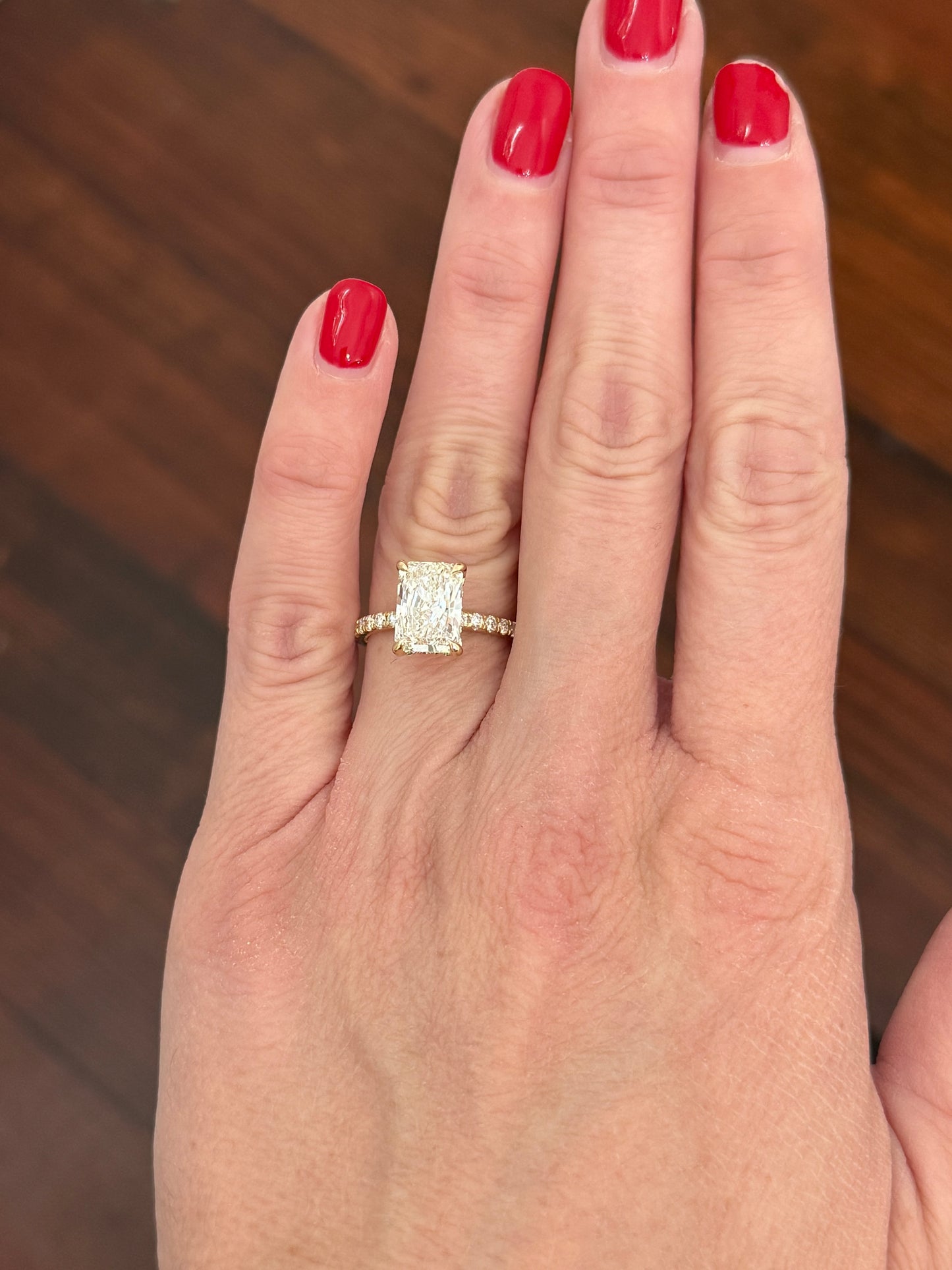 Yellow gold radiant lab diamond ring. Center stone is IGI certified and 3.0cts E VS1