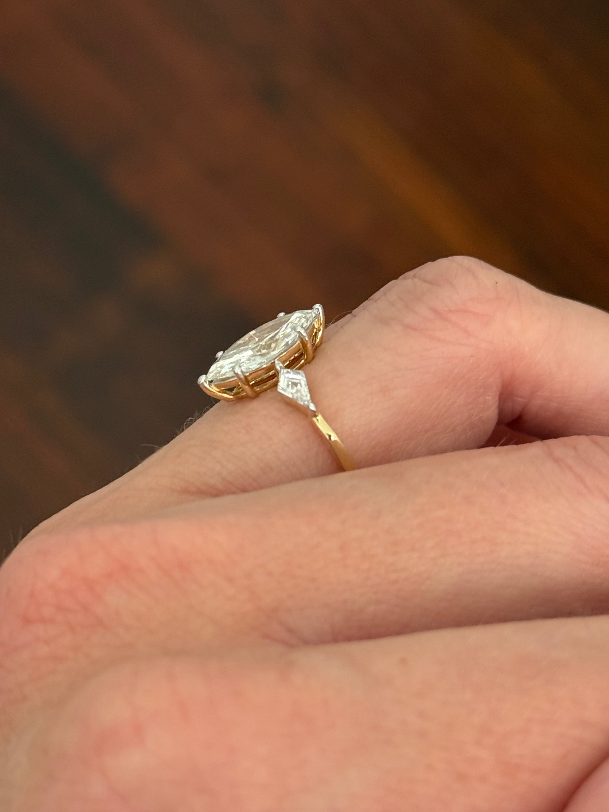 Yellow gold marquise and kite lab diamond ring. Prongs are white gold.