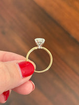 Yellow gold IGI certified oval lab diamond ring. Lab diamond is set in white gold