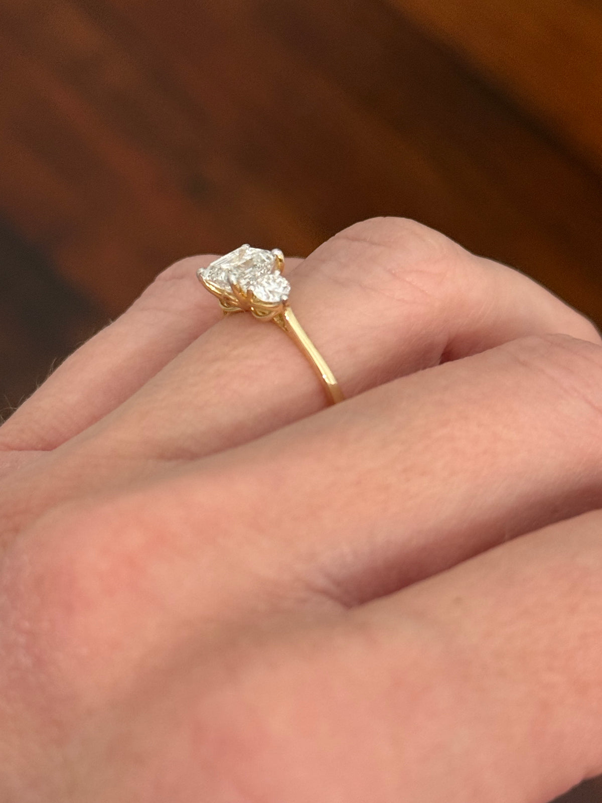 Yellow gold asscher and round lab diamond ring. Prongs are white gold.