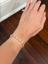 Yellow gold bezel set 7.44ct mixed shaped bracelet with oval, pear shape, marquise, princess and emerald cut natural diamonds