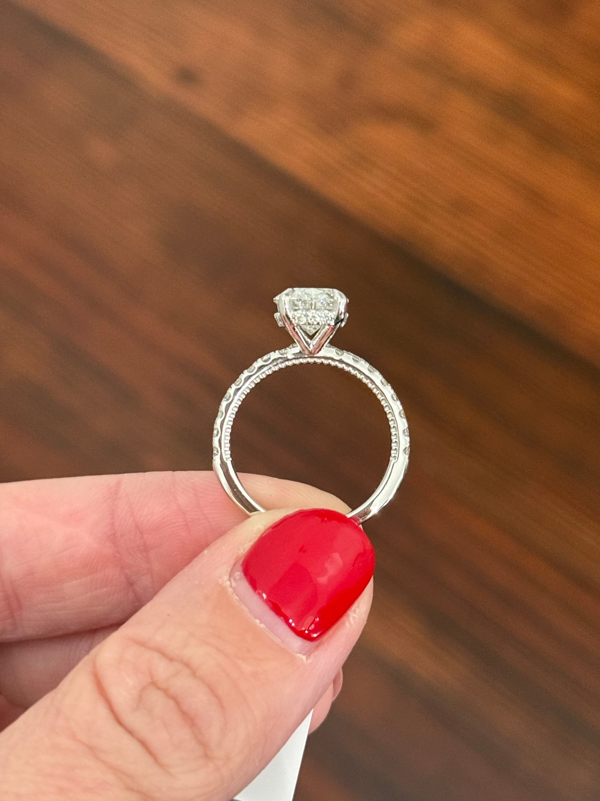 White gold oval lab diamond ring. Center stone is IGI certified and 3.03cts E VVS2