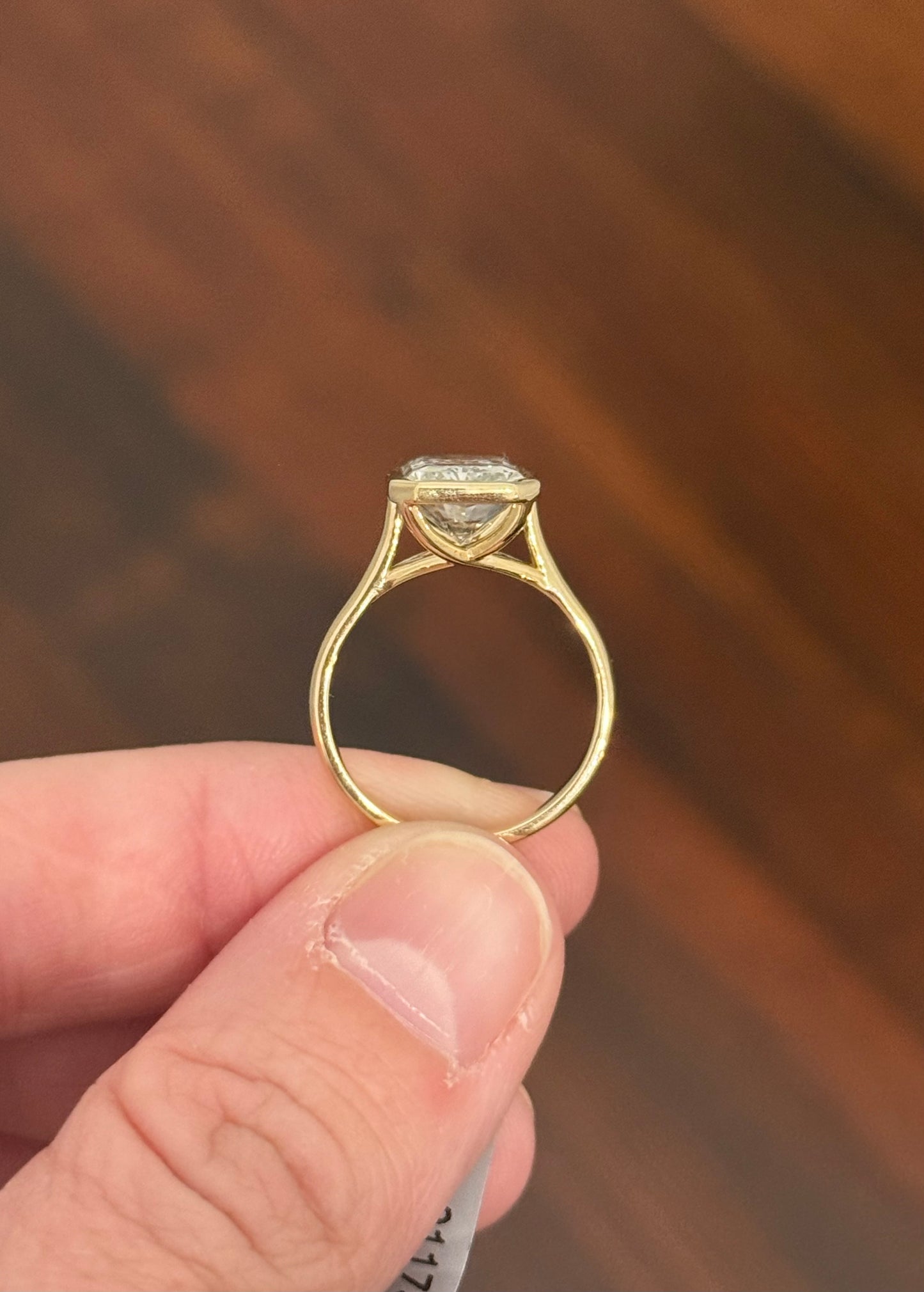 Yellow gold bezel set 3.99ct radiant lab diamond ring
