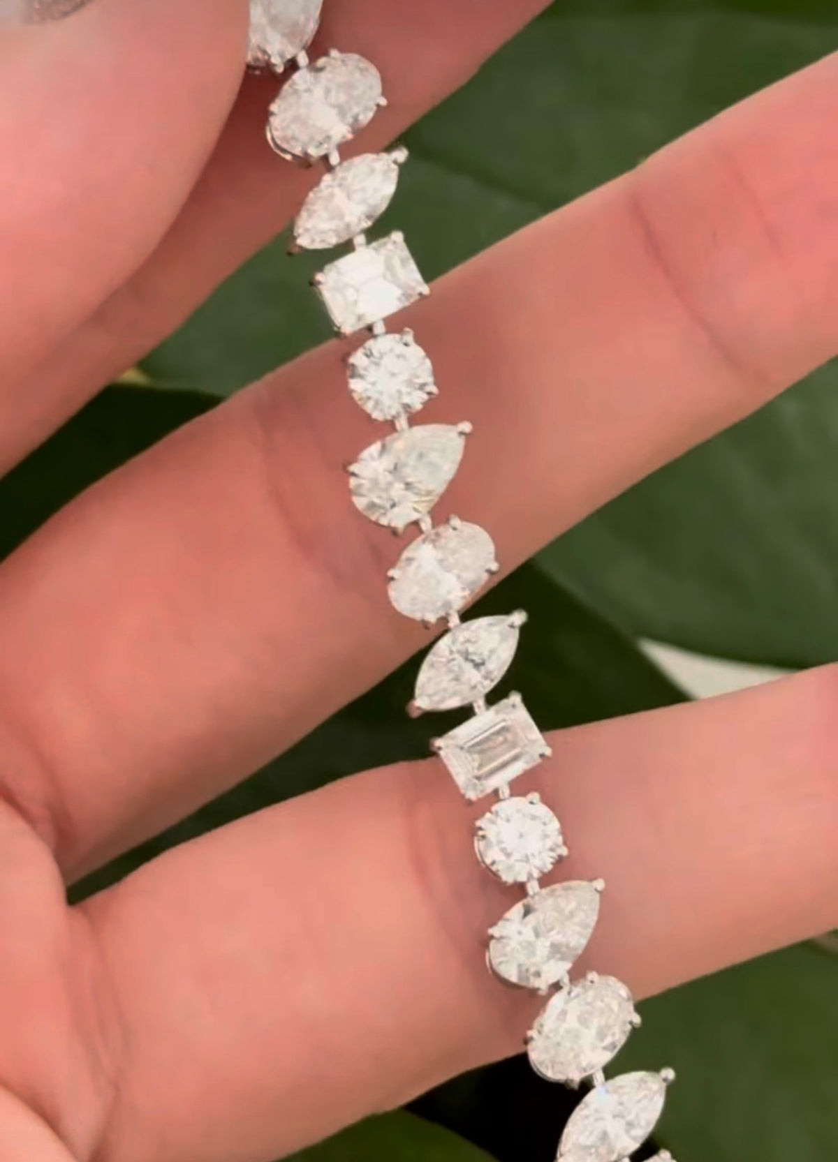White gold mixed shape bracelet with 15.57cts of pear shape, oval, marquise, emerald cut and round lab diamonds