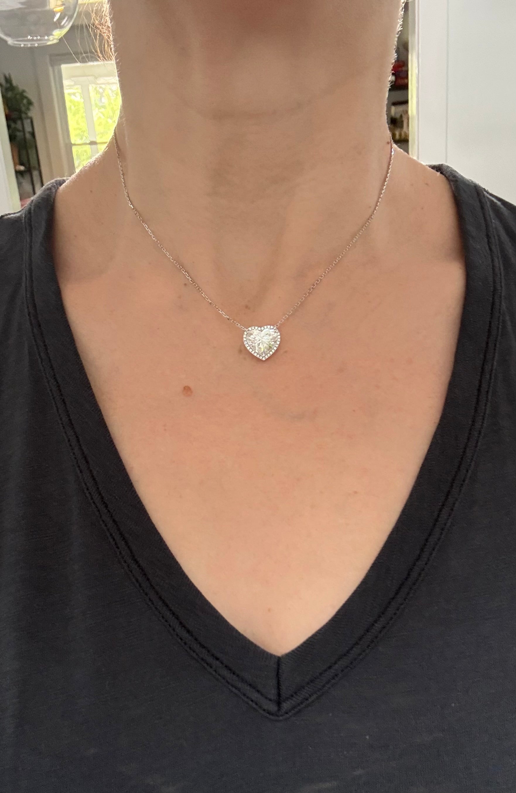 White gold heart shape lab diamond necklace. Center stone is 5.08cts and measures 10.x11.3mm. Chain is 16” with 4” of adjustment to make as long as 20”.