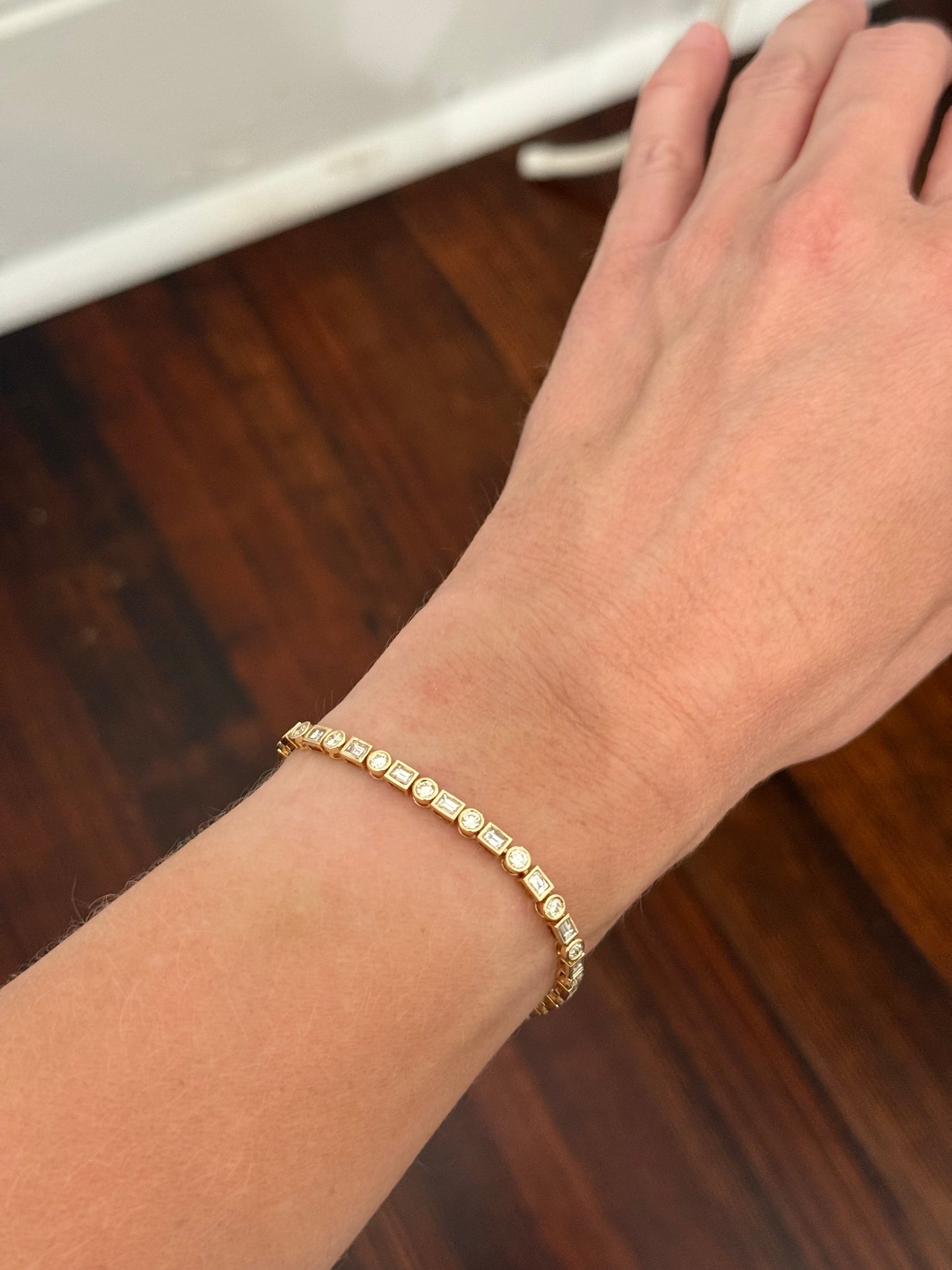 Yellow gold bezel set 3.81ct emerald cut and round natural diamond bracelet