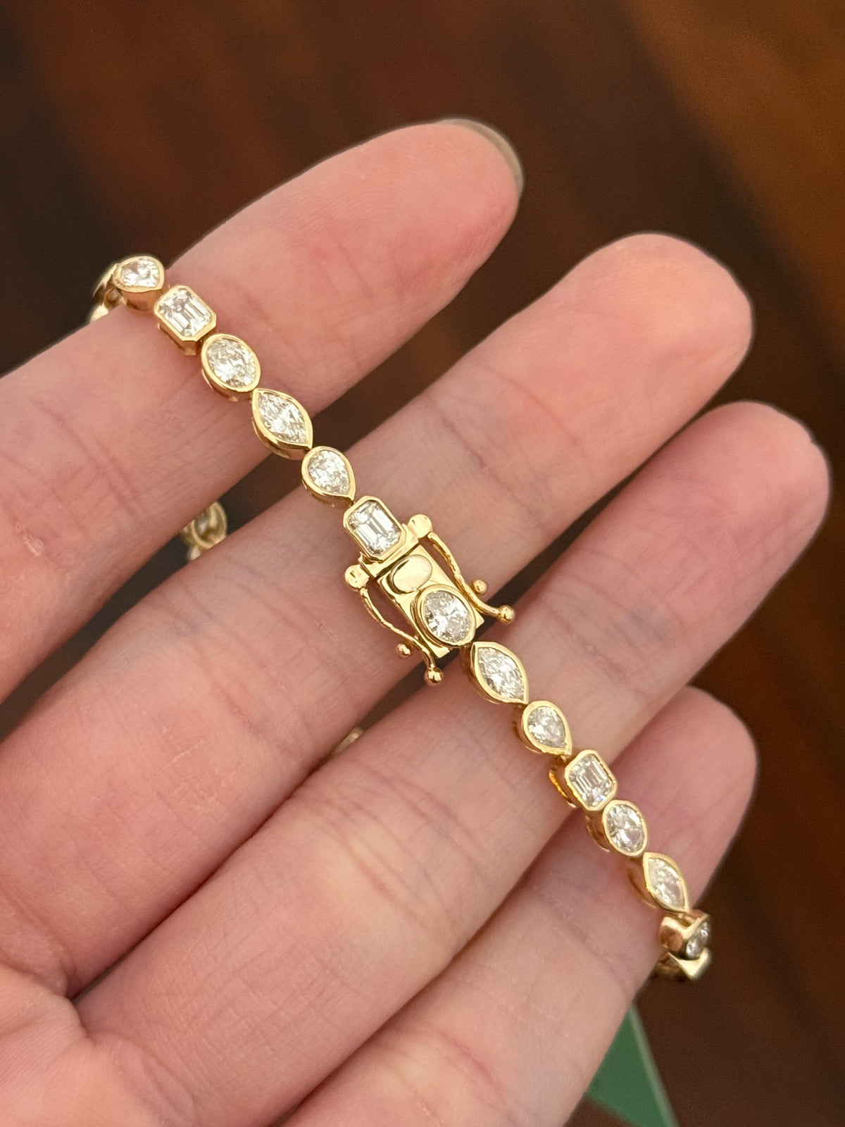 Yellow gold bezel set 5.35ct oval, marquise, pear shape and emerald cut natural diamond bracelet