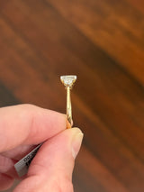 Yellow gold asscher and round lab diamond ring. Prongs are white gold.