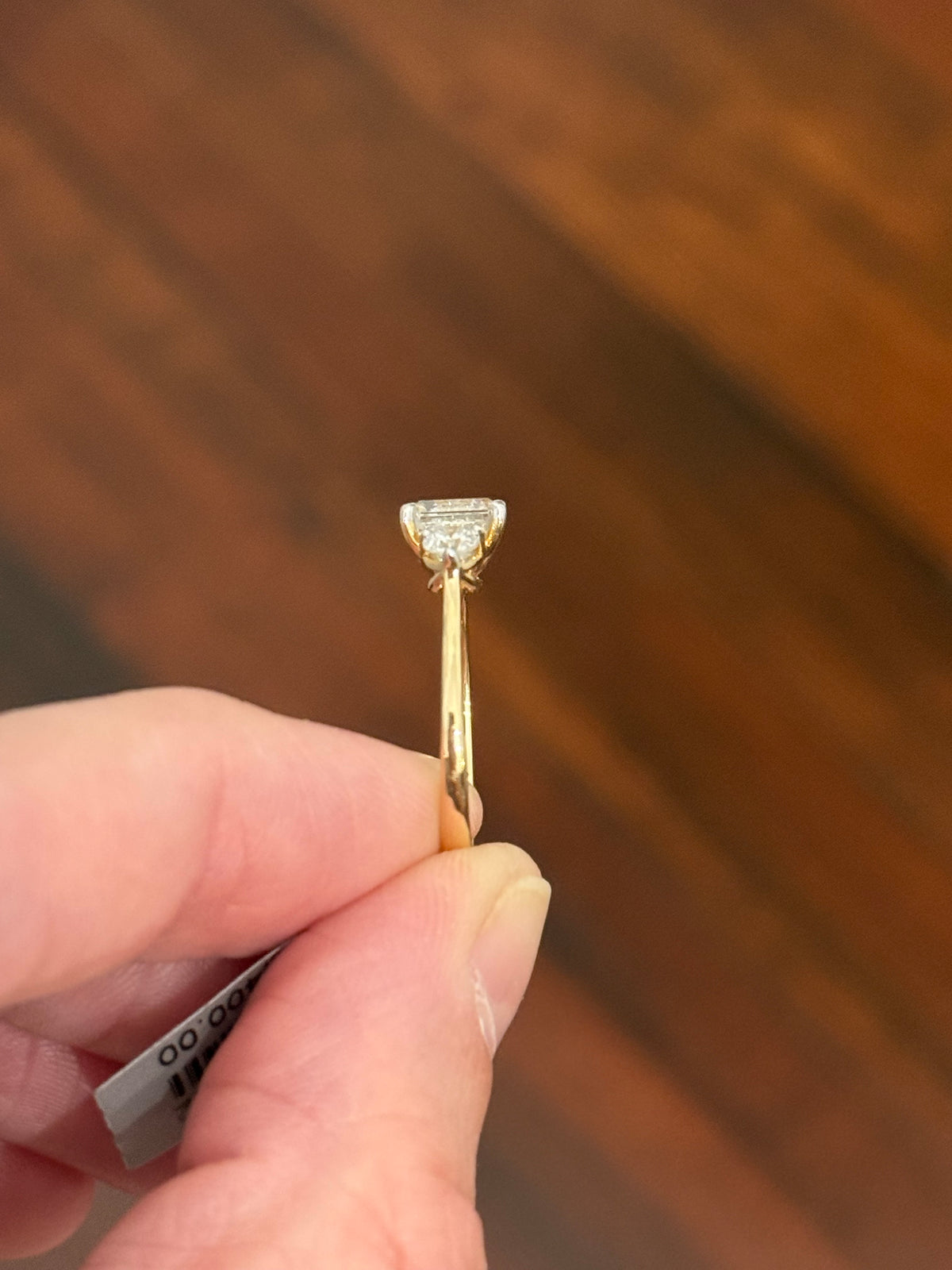 Yellow gold asscher and round lab diamond ring. Prongs are white gold.
