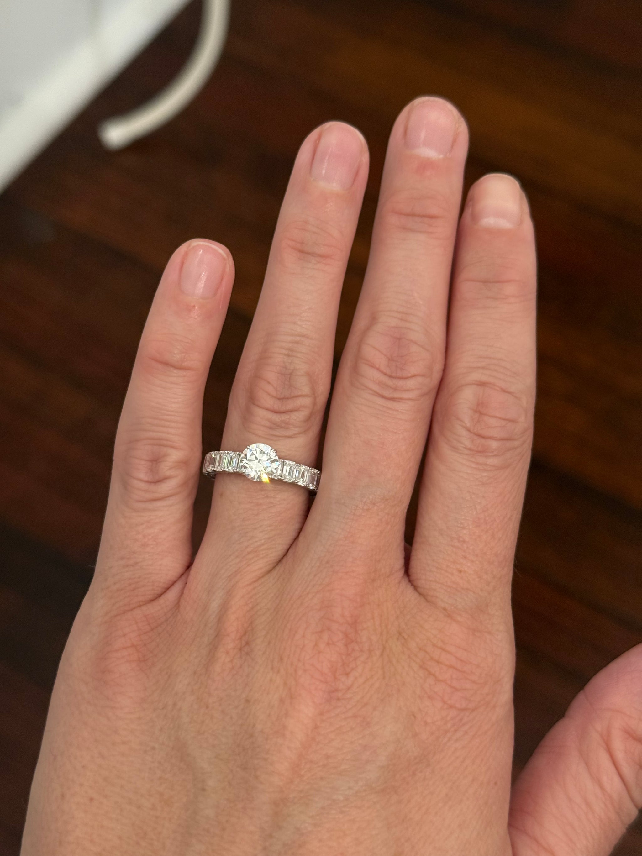 White gold 1.09ct round lab diamond and 4.1ct emerald cut eternity ring