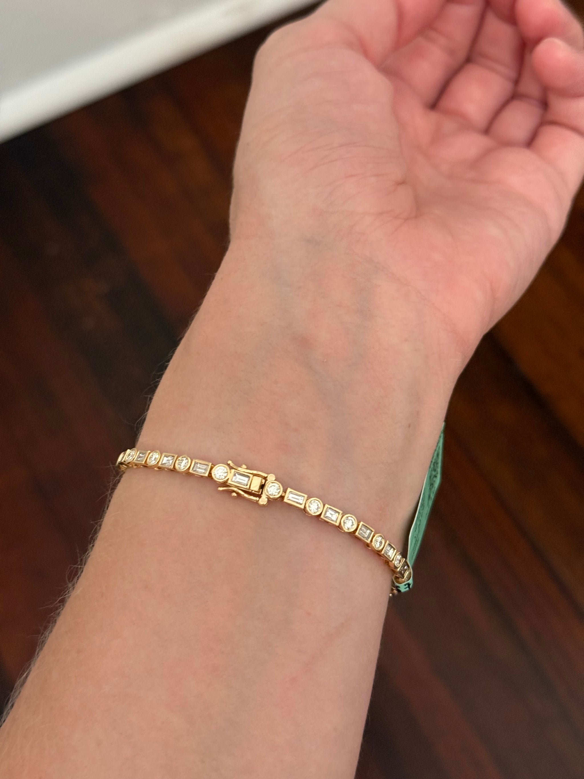 Yellow gold bezel set 3.81ct emerald cut and round natural diamond bracelet