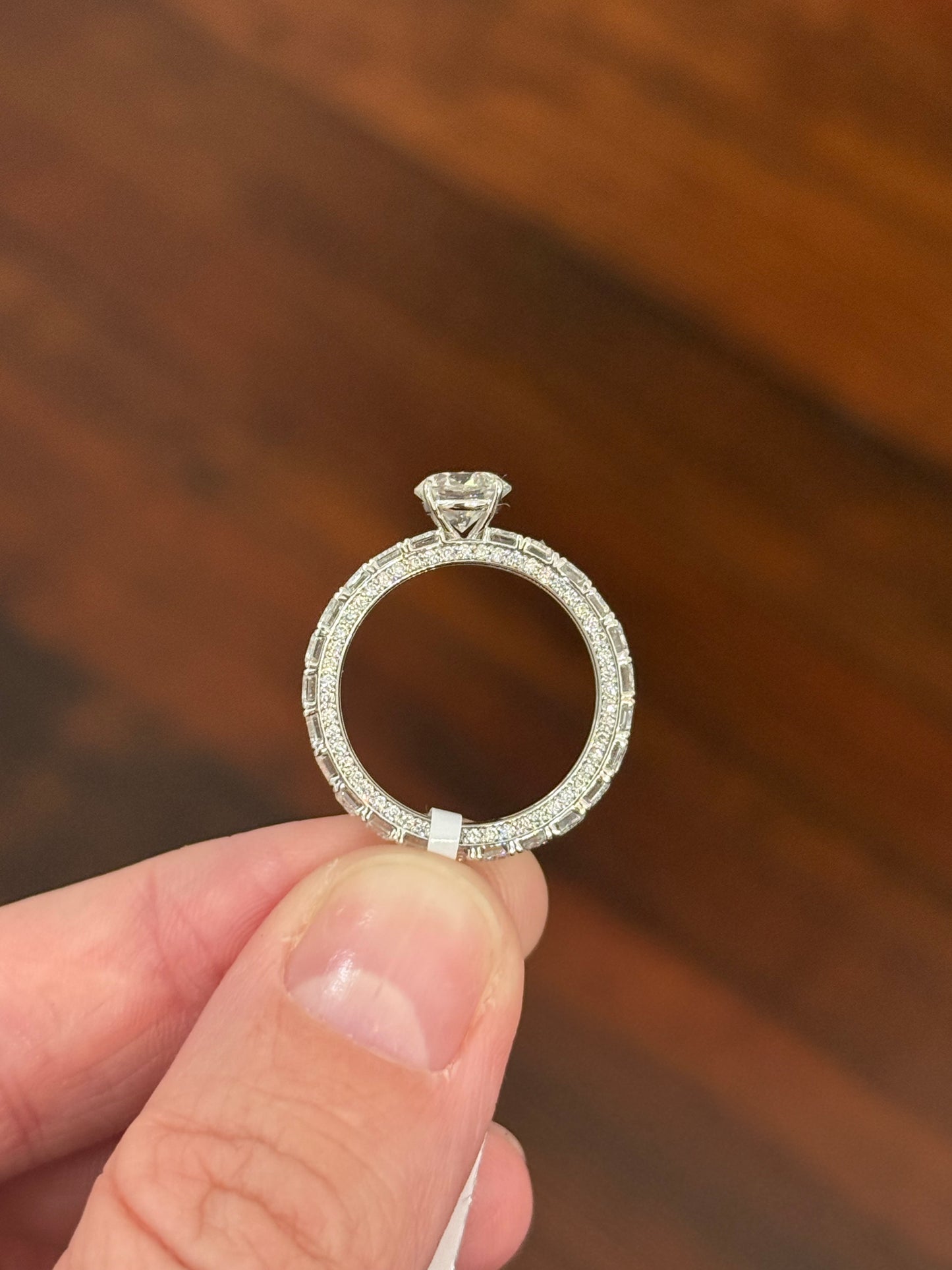 White gold 1.09ct round lab diamond and 4.1ct emerald cut eternity ring