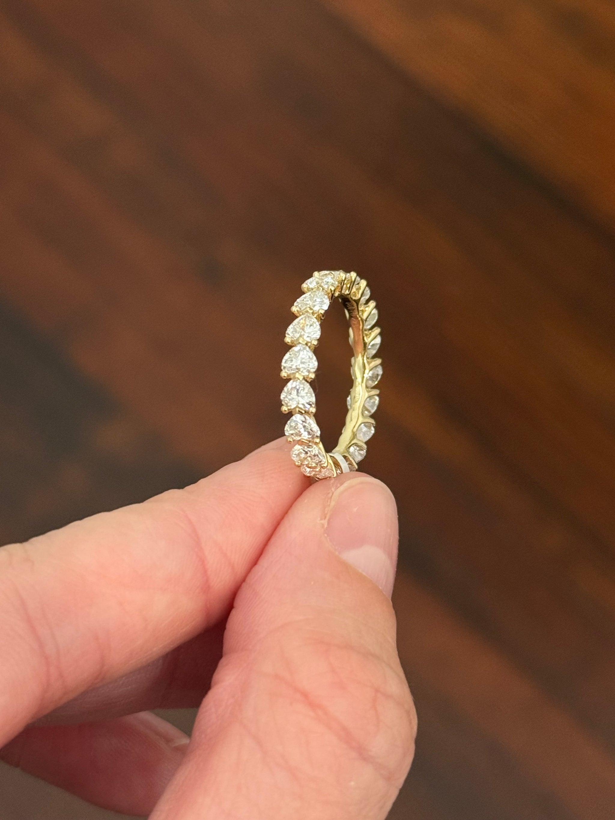 Yellow gold 3.01ct heart shaped lab diamond eternity band