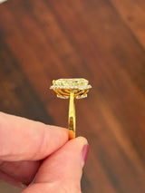 Yellow gold pear shape yellow lab diamond and white lab diamond ring