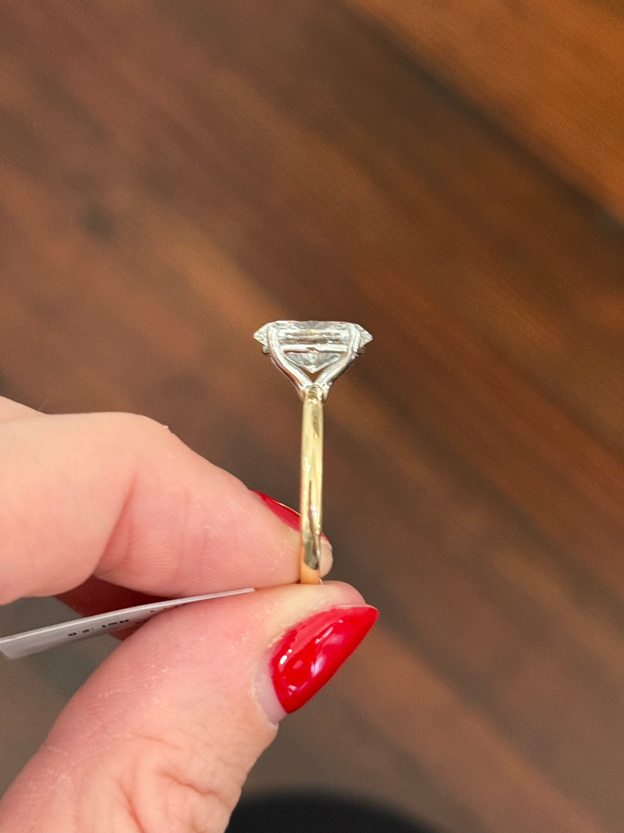 Yellow gold IGI certified oval lab diamond ring. Lab diamond is set in white gold