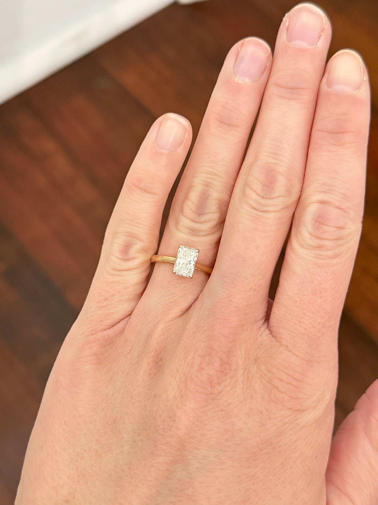 Yellow gold with white gold prongs radiant lab diamond ring