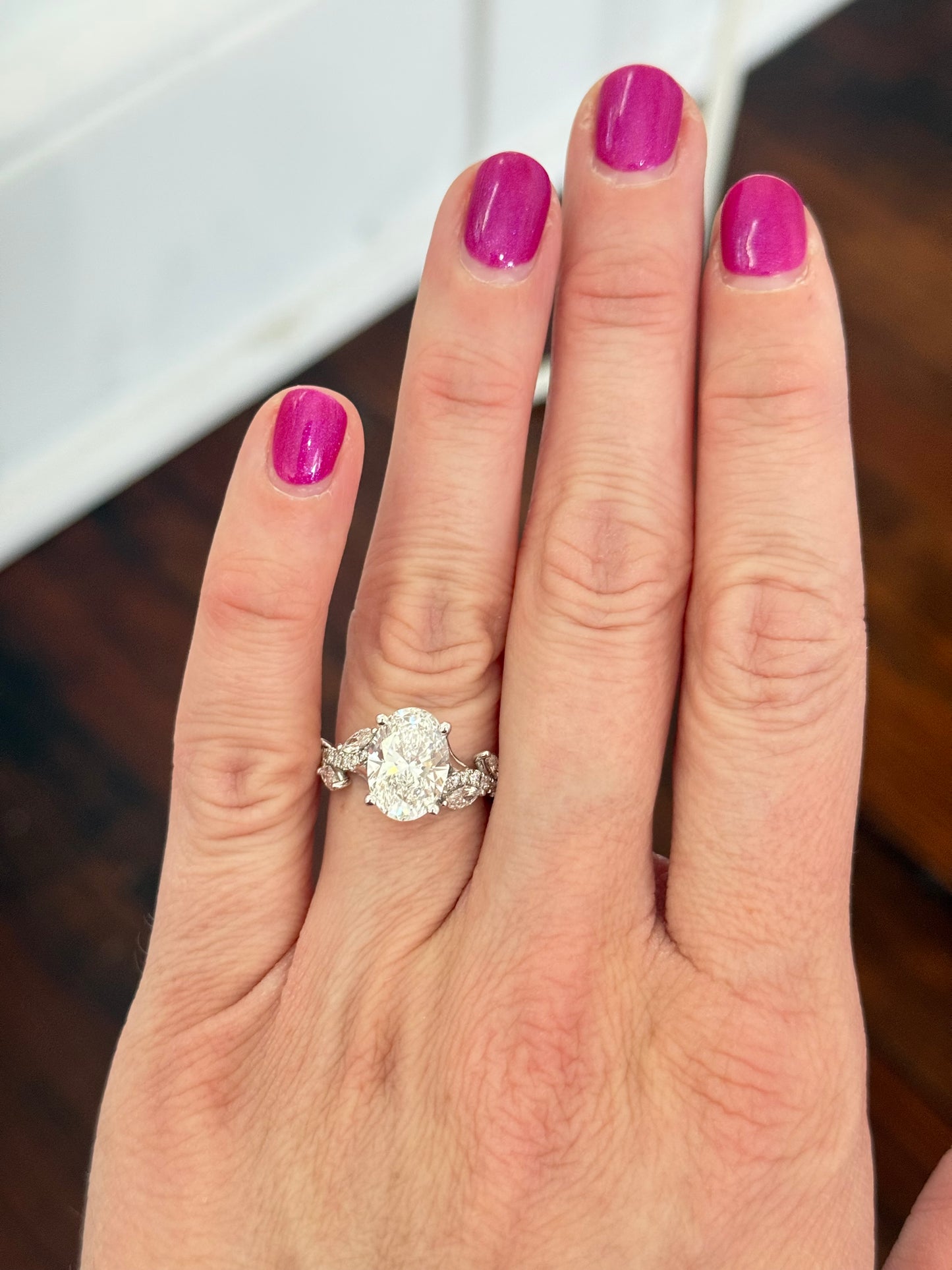White gold oval, marquise and round lab diamond ring. Center stone is 3.07cts