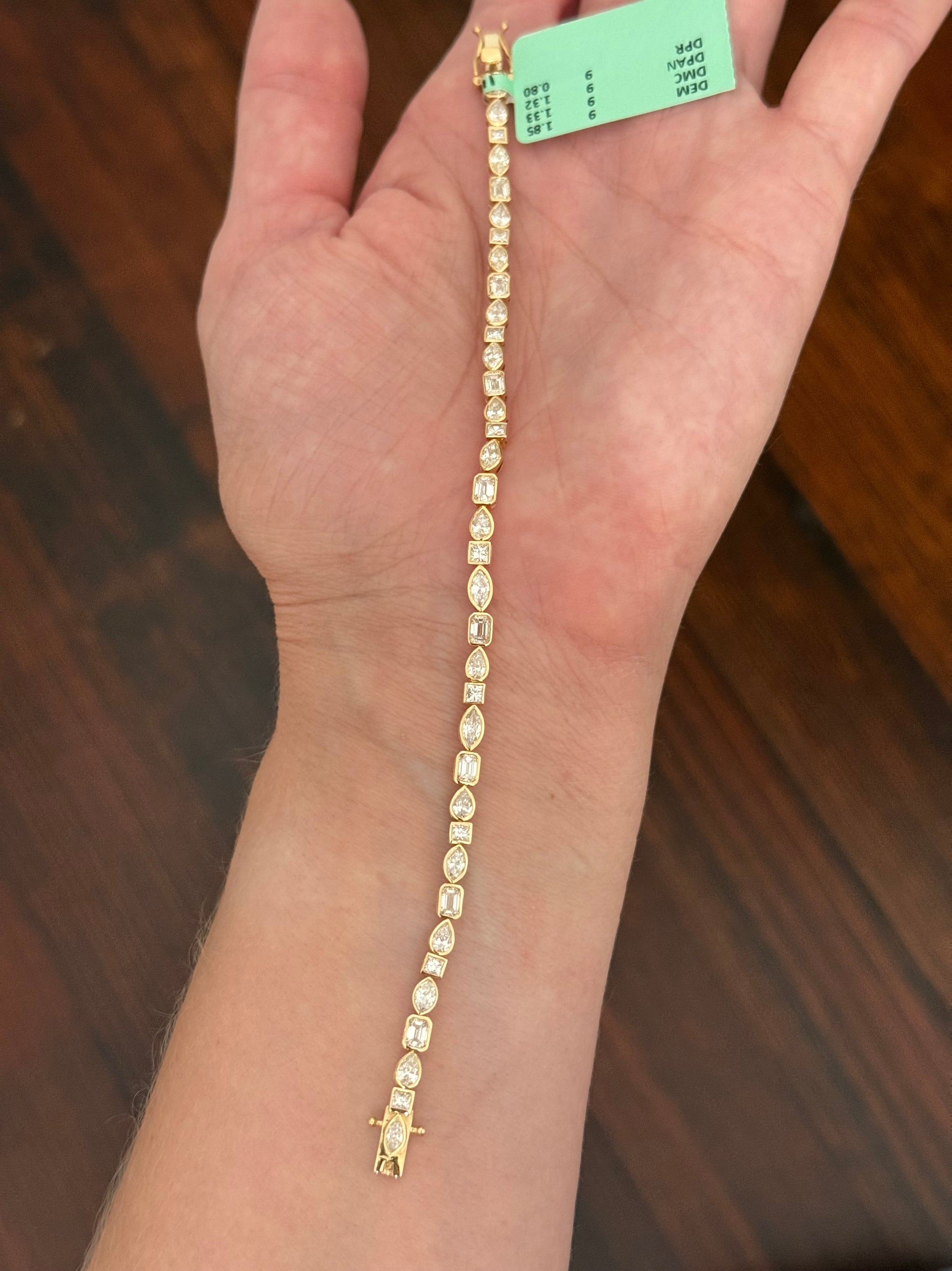 Yellow gold bezel set 5.3ct pear shape, marquise, princess and emerald cut natural diamond bracelet