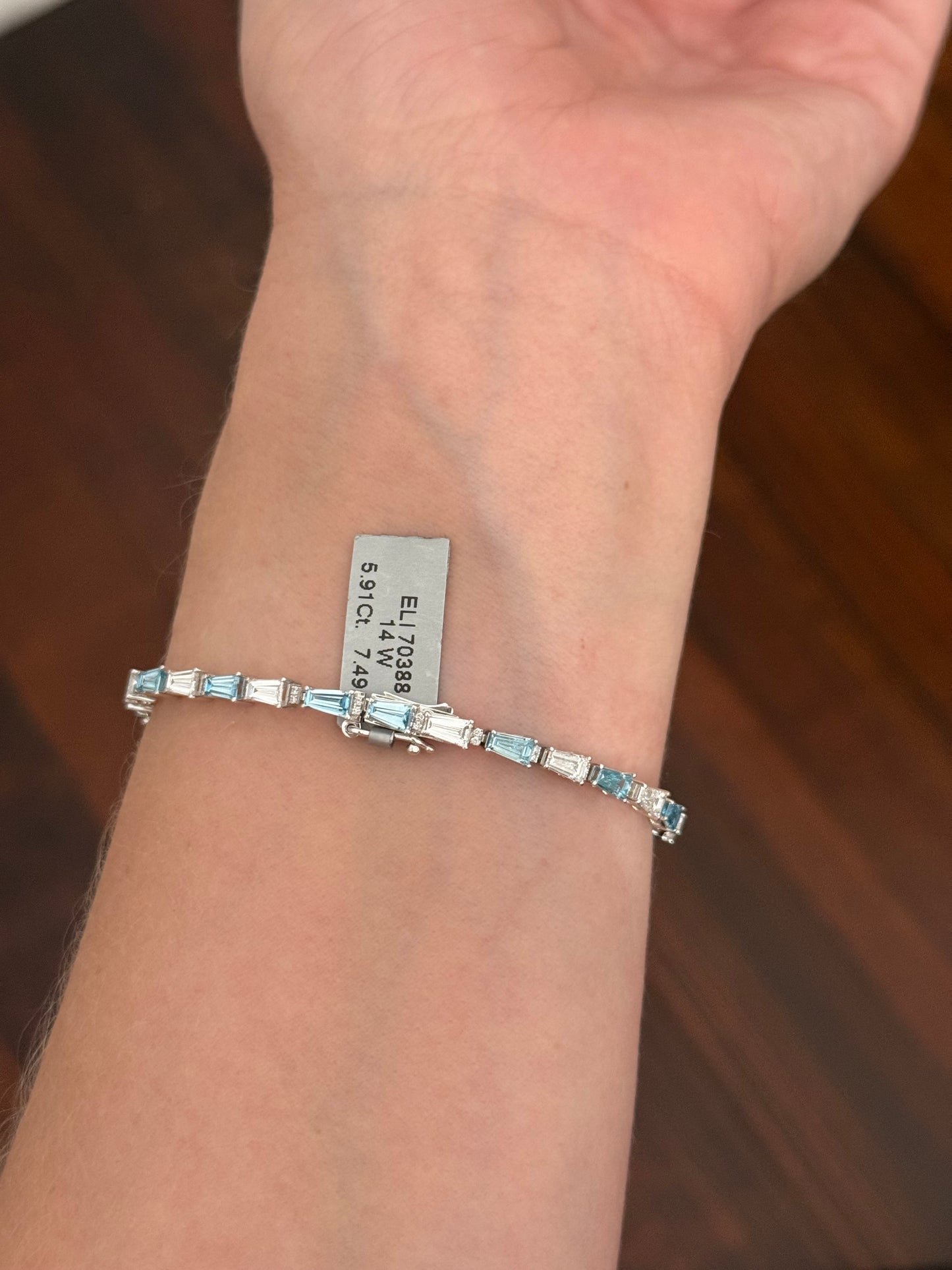 White gold 5.91ct tapered baguette blue and white lab diamond bracelet
