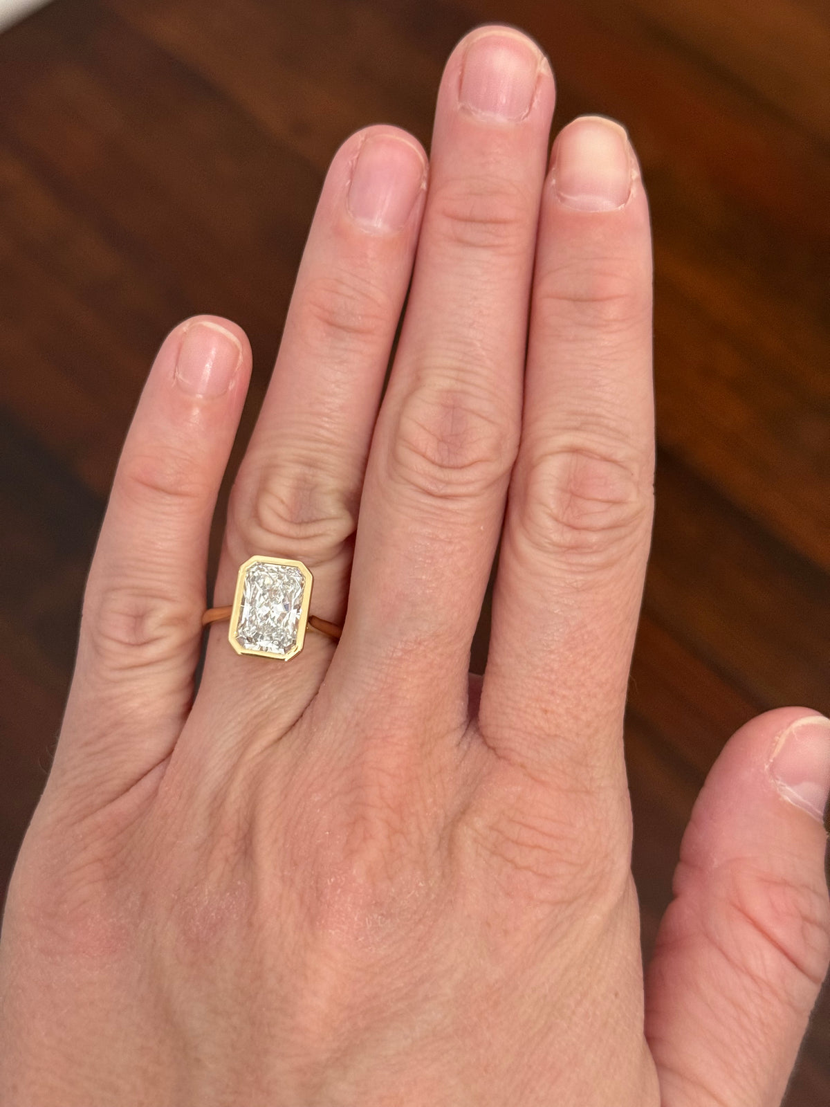 Yellow gold bezel set 3.99ct radiant lab diamond ring