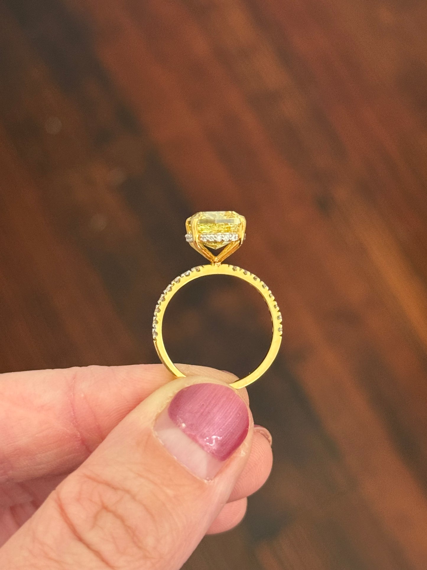 Yellow gold elongated cushion cut yellow lab diamond and white lab diamond ring