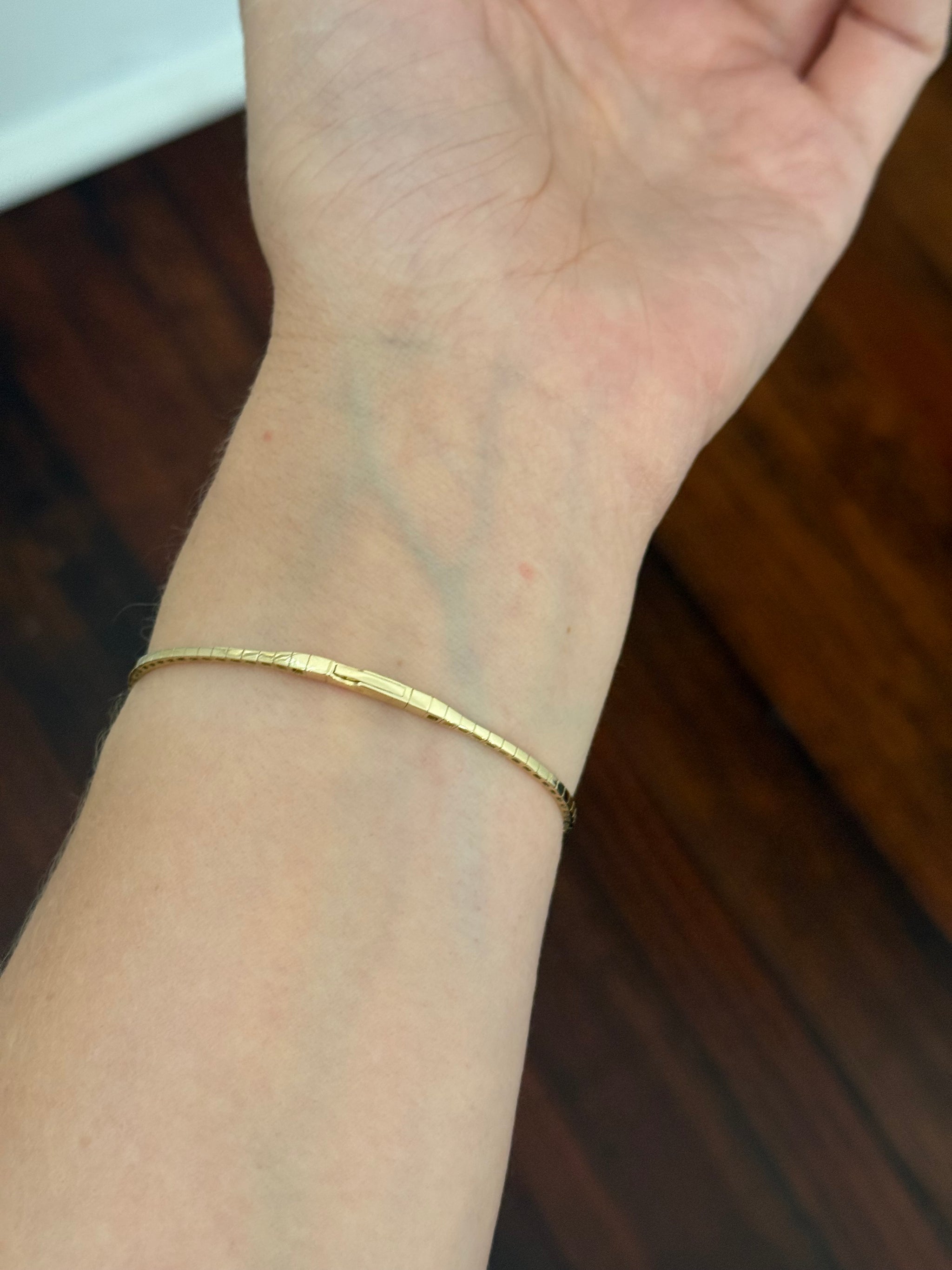 Yellow gold lab diamond flex bracelet. Lab diamonds are set in white gold.