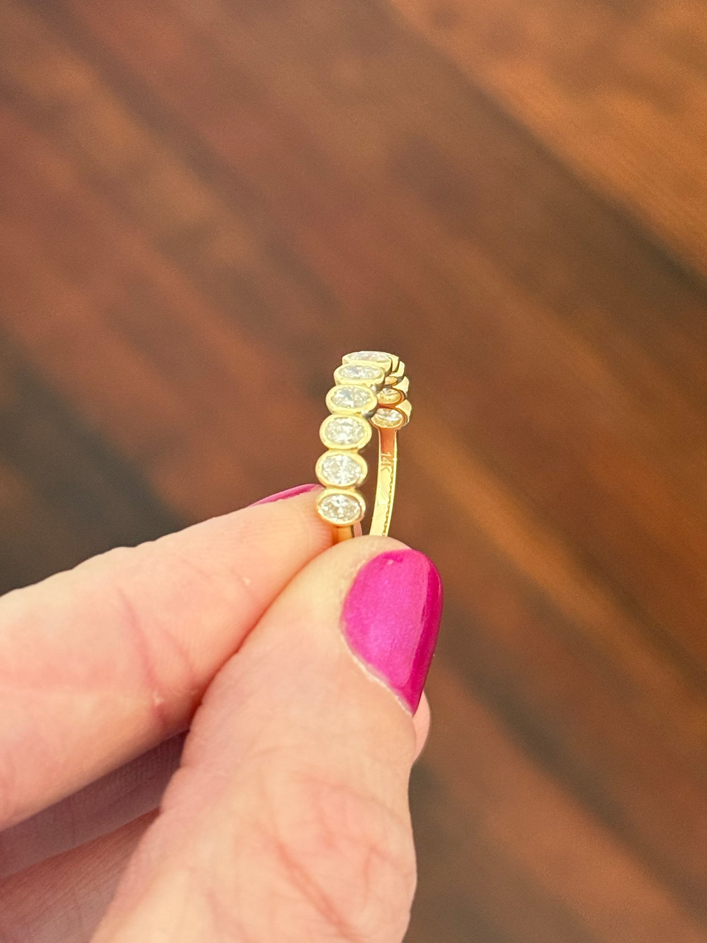 Yellow gold bezel set oval lab diamond band