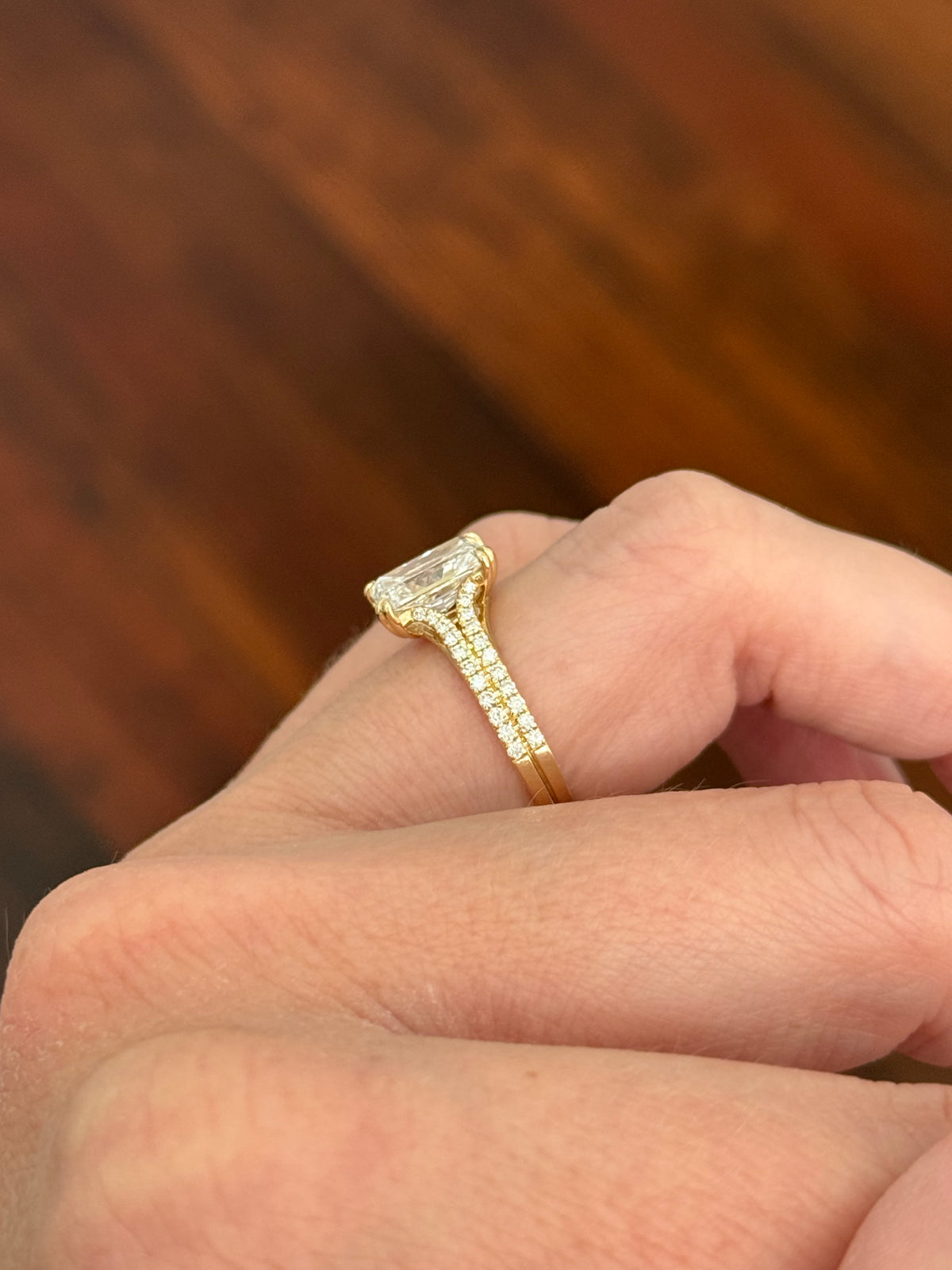 Yellow gold radiant and round lab diamond ring