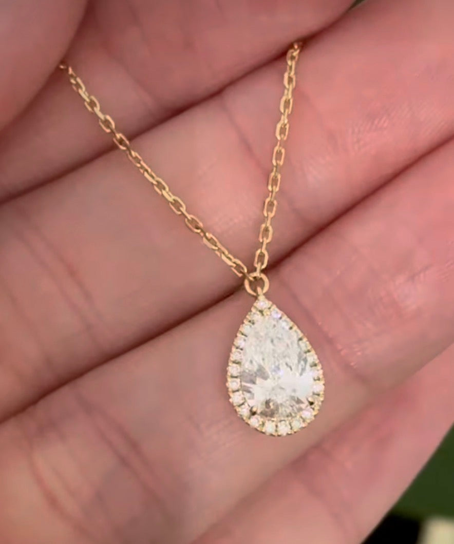 Yellow gold pear shaped lab diamond necklace. Center stone is 1.05cts and measures 8.6x5.4mm. Chain is 16” with an adjustment of 4” to make as long as 20”.