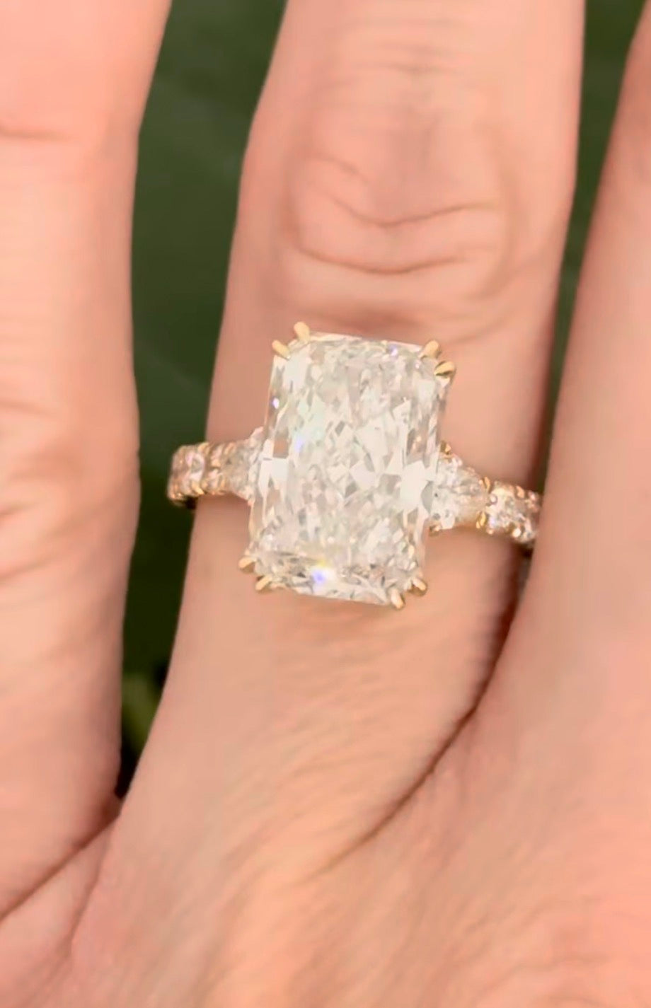 IGI certified radiant and trillion and round lab diamond ring. Center stone is 5.44cts