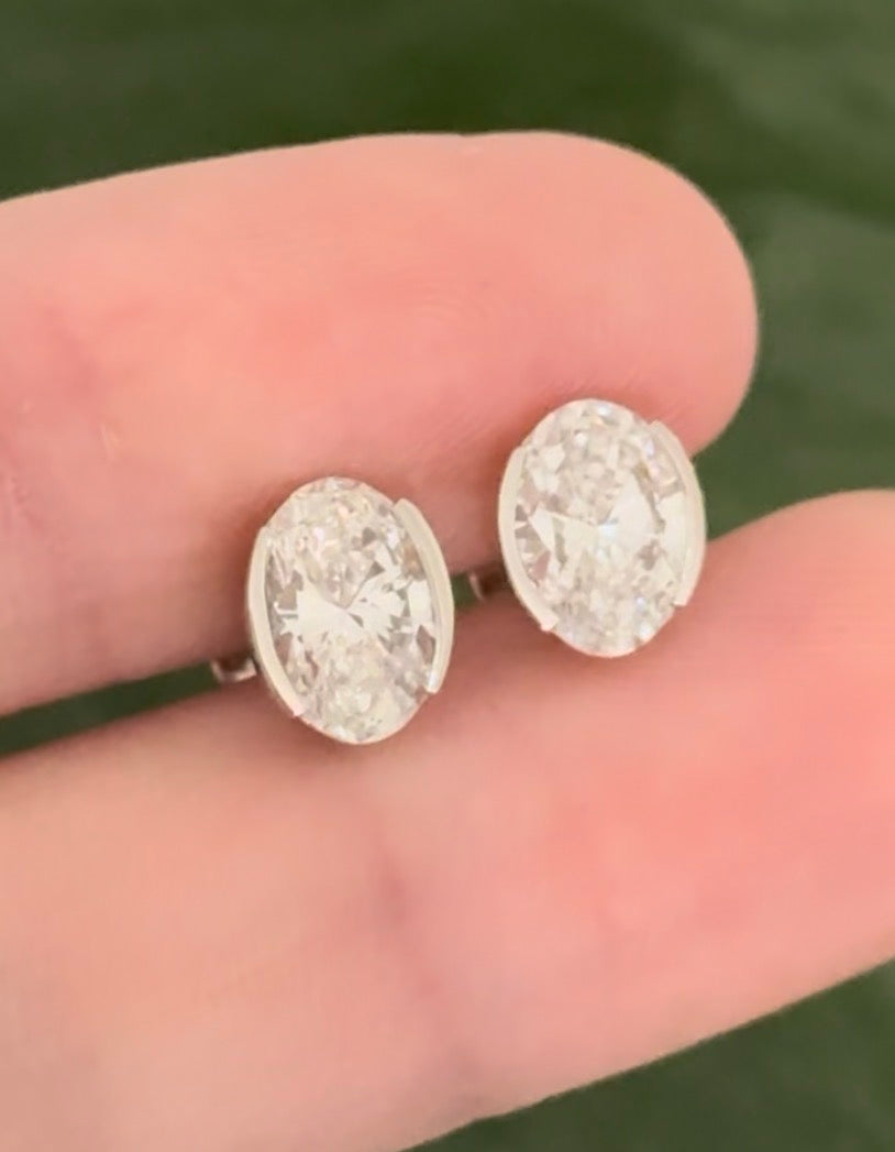White gold bezel set oval lab diamond stud earrings