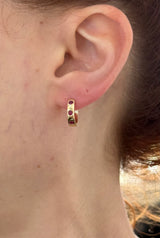 14.3mm hoop earrings available in yellow gold with rubies and white gold with emeralds
