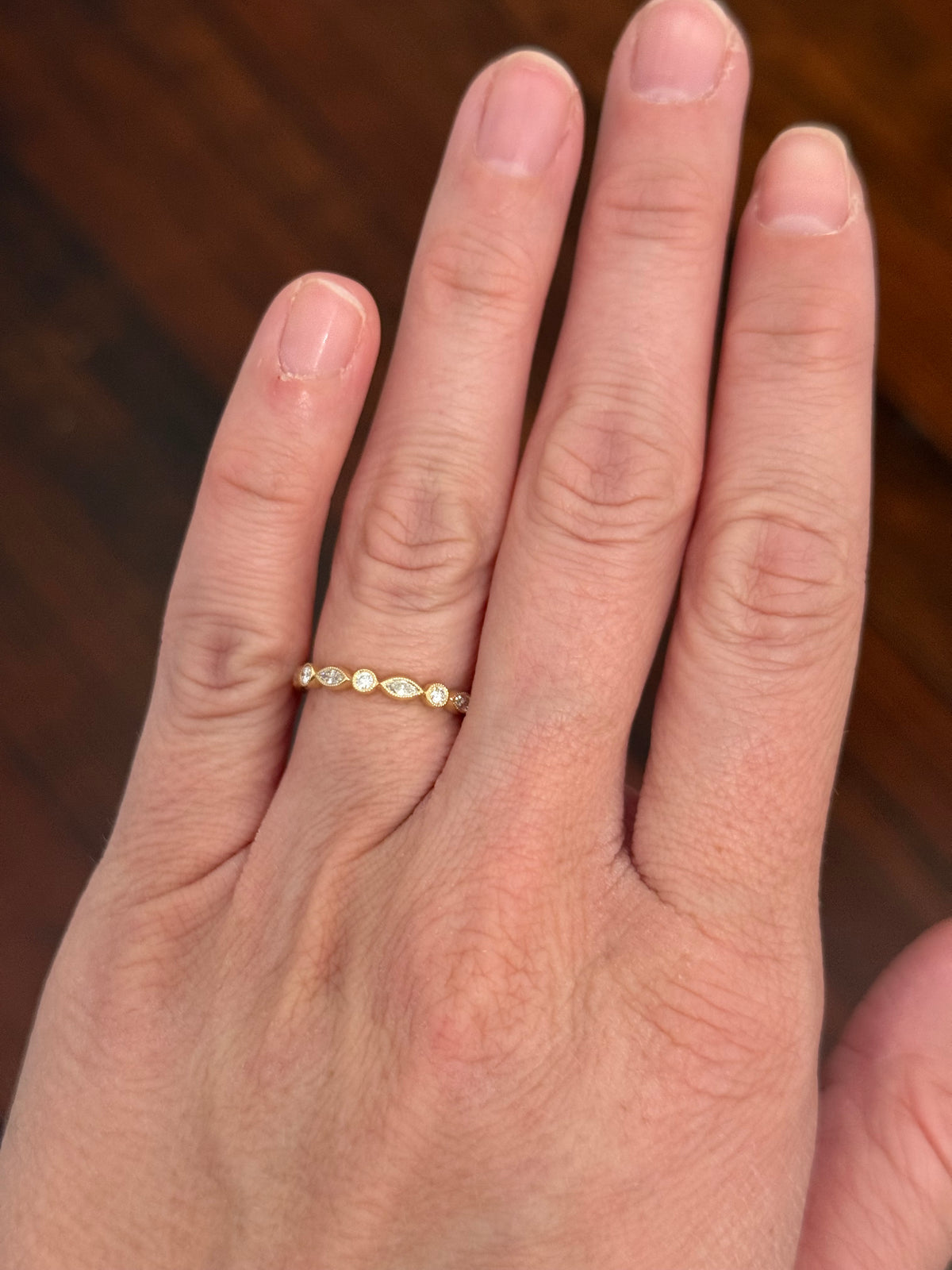 Yellow gold bezel set marquise and round lab diamond band