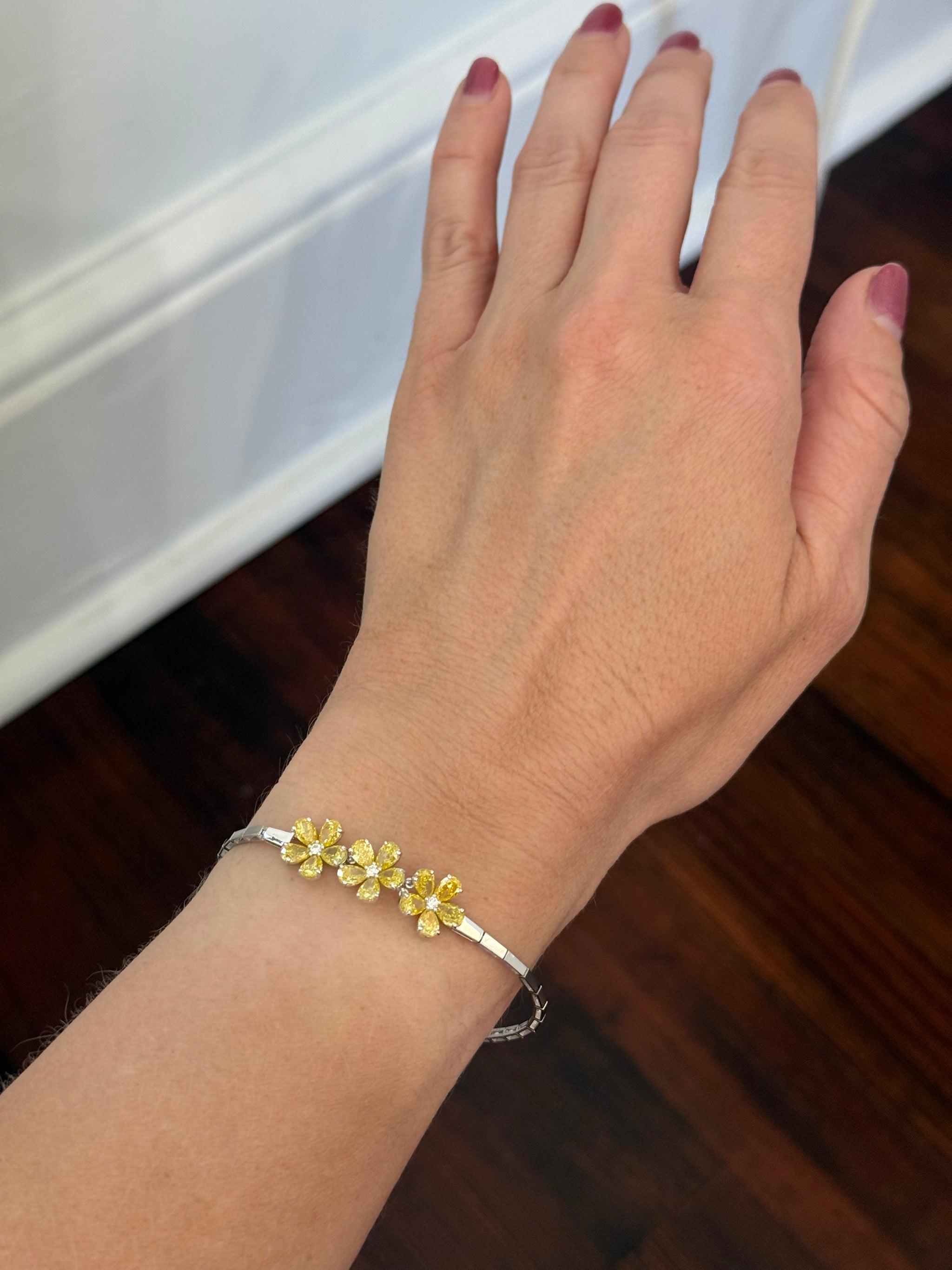 White gold flower bracelet with pear shaped yellow lab diamonds and round white lab diamonds