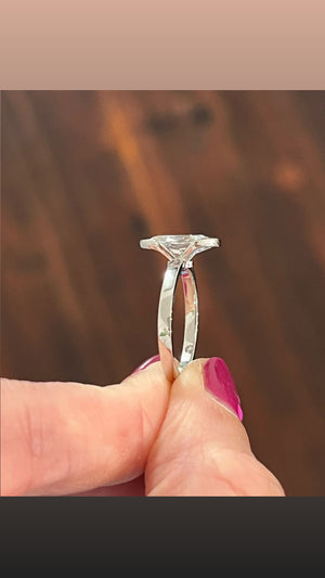 White gold oval step cut lab diamond ring