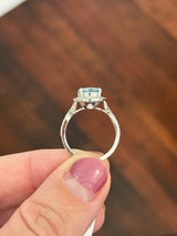 White gold oval blue lab diamond and white lab diamond ring